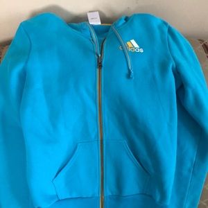 Adidas Women’s light blue zip down sweatshirt with pockets and hood